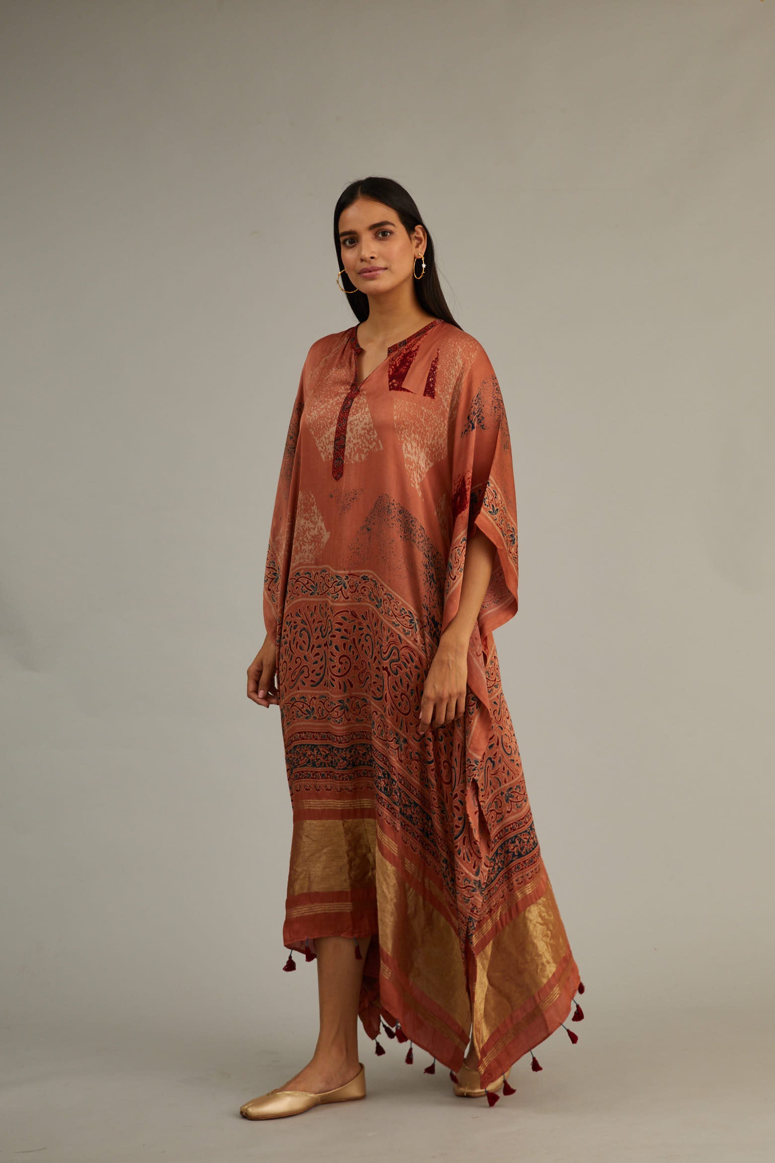 Peach Hand blocked Ajrakh Kaftan with Tassels.
