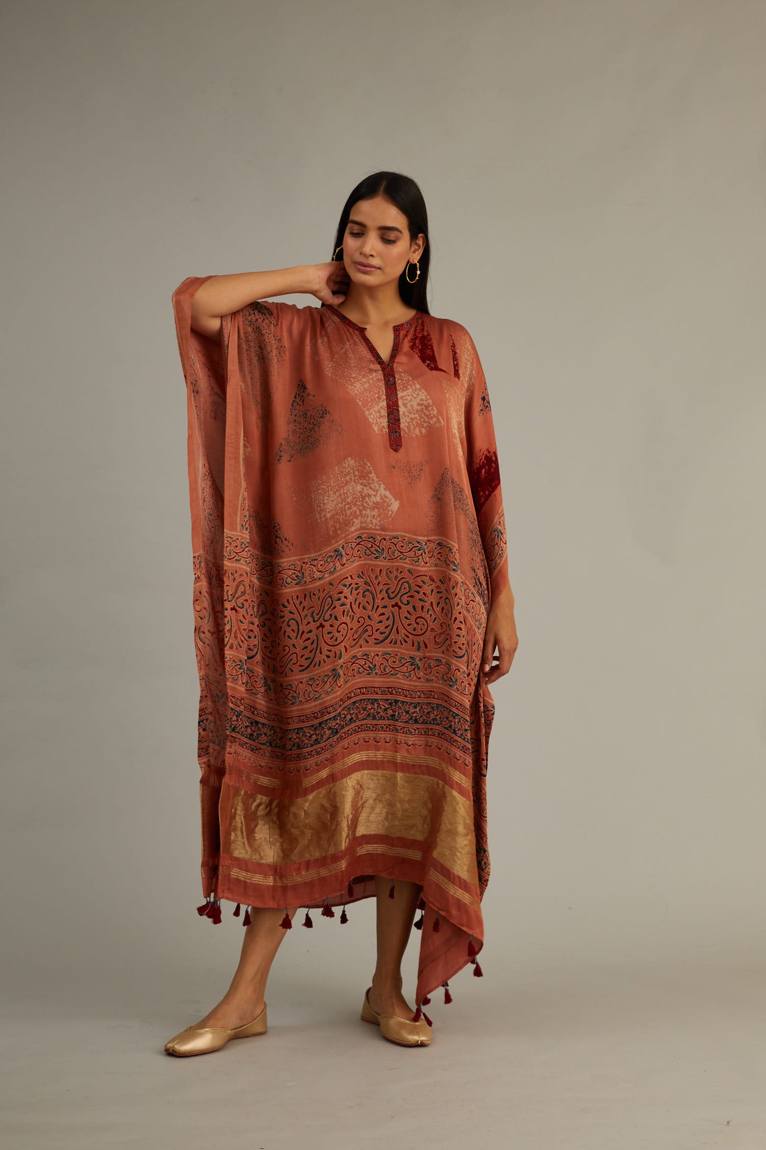Peach Hand blocked Ajrakh Kaftan with Tassels.