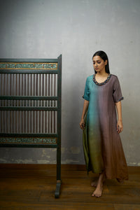 Mauve Blue Asymmetric Dupion Silk Ombre Kurta With Embroidered Cluster Of Potlis Around Neckline .