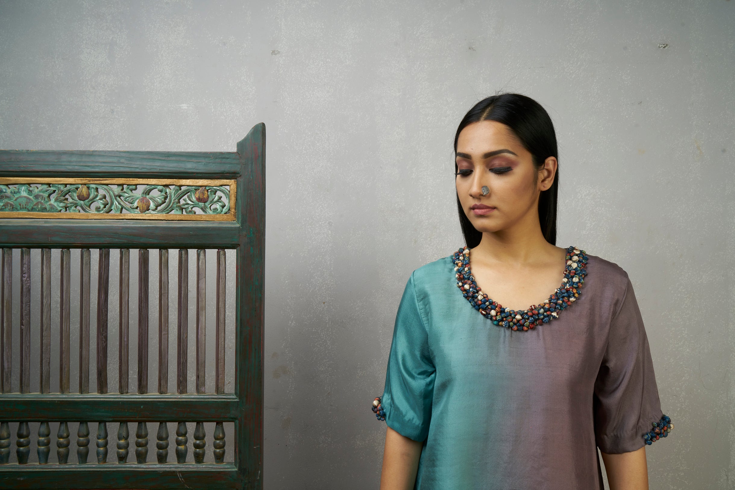 Mauve Blue Asymmetric Dupion Silk Ombre Kurta With Embroidered Cluster Of Potlis Around Neckline .