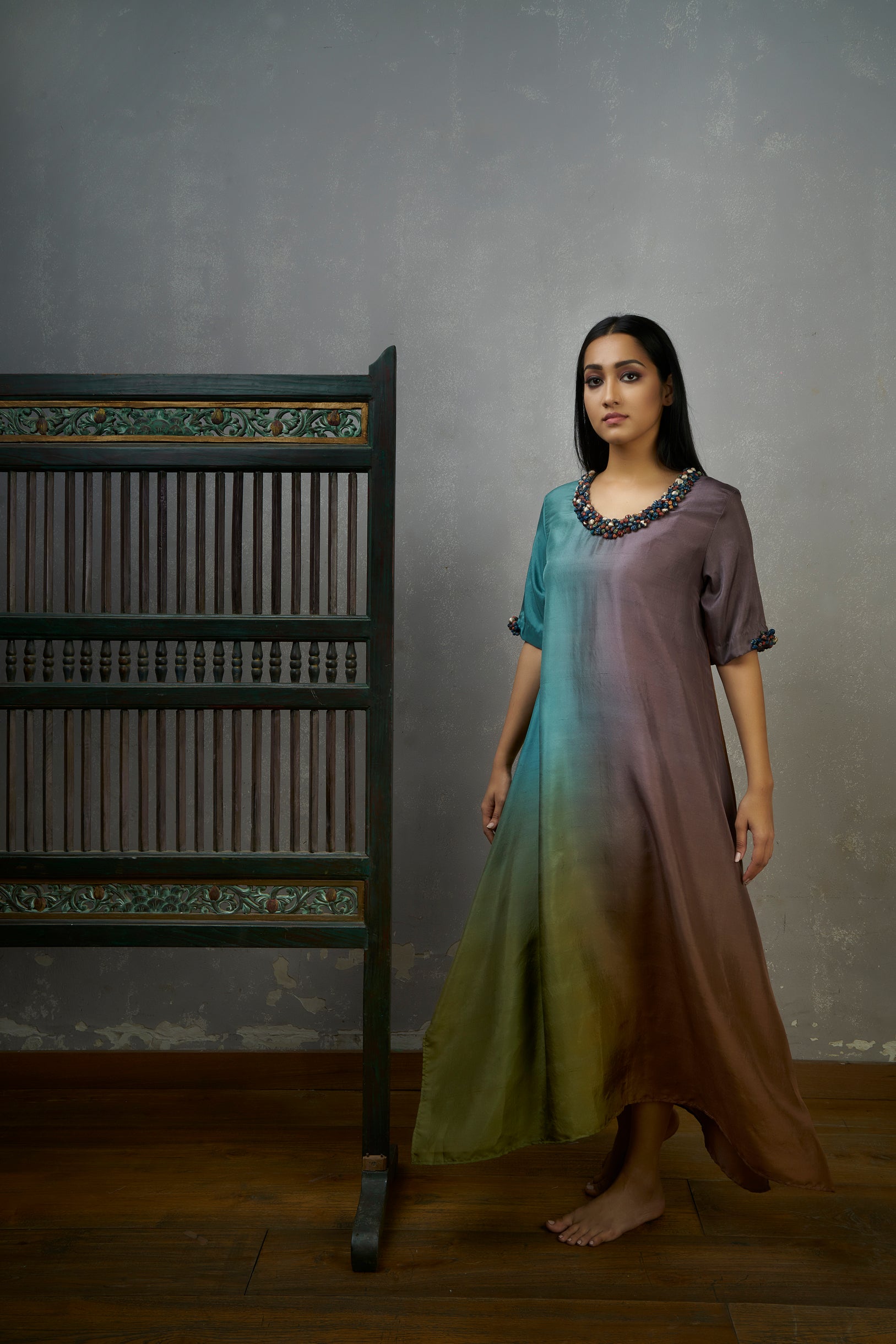 Mauve Blue Asymmetric Dupion Silk Ombre Kurta With Embroidered Cluster Of Potlis Around Neckline .