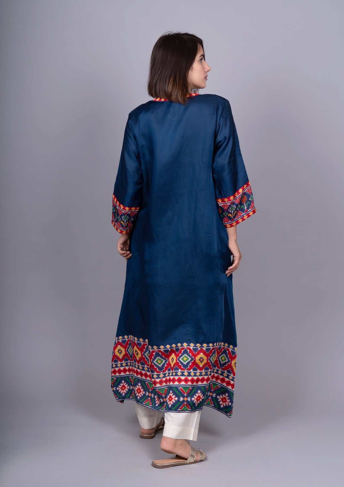 Navy Blue Solid Kurta With Asymmetric Patola Print Hemline.