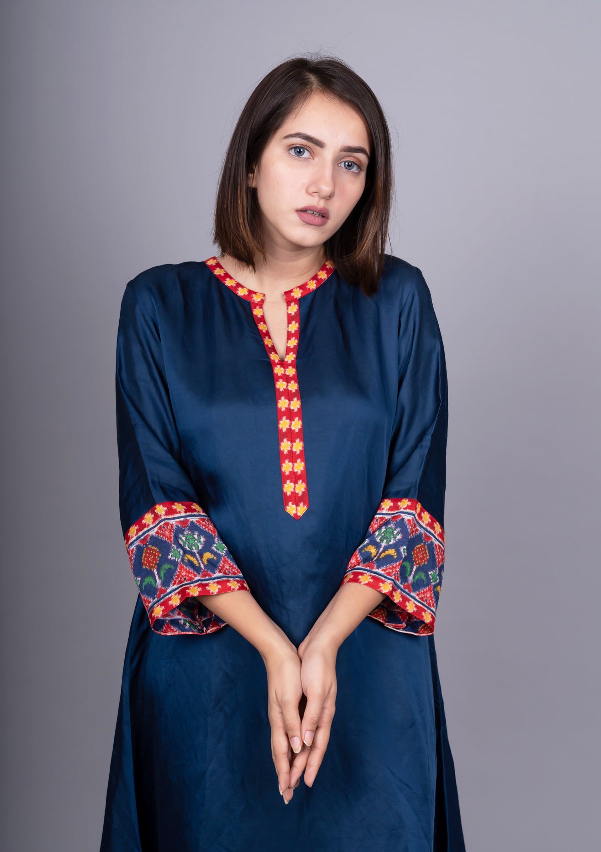Navy Blue Solid Kurta With Asymmetric Patola Print Hemline.